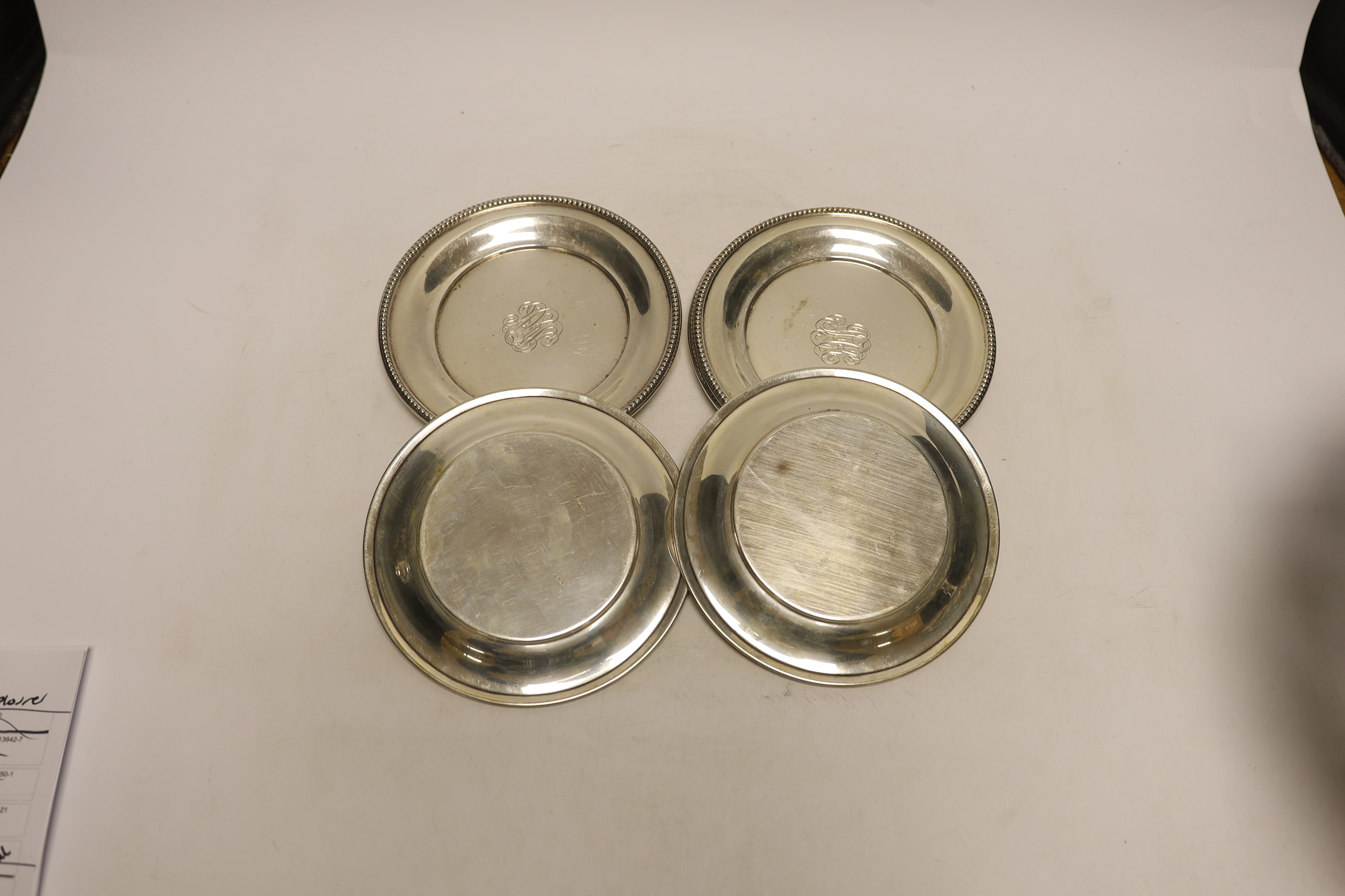 A set of six American sterling dishes, by R. Wallace & Sons, with engraved monogram and beaded borders, 15.1cm, 18.8oz.